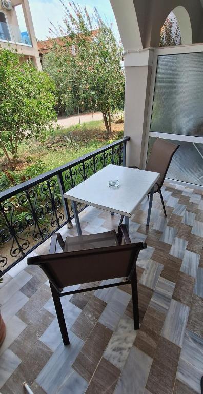 Private balcony overlooking the garden at Antzela Apartments